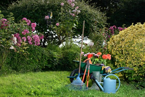 Gardener working safely with tools in Oakleigh Park