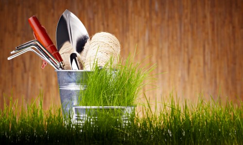 Local gardener in Oakleigh Park pruning shrubs and borders